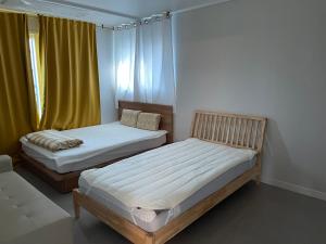 Postel nebo postele na pokoji v ubytování 뚠하우스3 + 16 fotografií