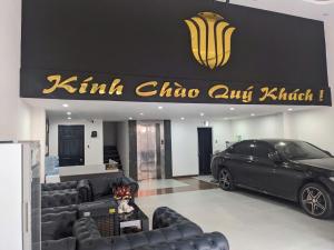 a car parked in front of a car dealership at Khách sạn Thy Thảo 3 in Ho Chi Minh City
