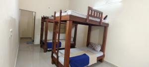 Una cama o camas en una habitación de Sierra coorg Homestay