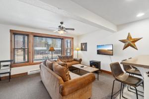 a living room with a couch and a table at The Loose Moose Lodge #7 At Downtown Grand Lake N in Grand Lake