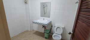 a bathroom with a sink and a toilet at Jomtien Hostel in Jomtien Beach +58 photos