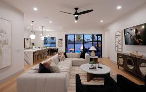 a living room with a couch and a table at Sunrift-Private Pool & Spa-Walk to Old Town in Scottsdale