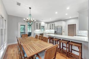 a kitchen with a wooden table and chairs at SI2638: 2638 Seabrook Island Road in Seabrook Island