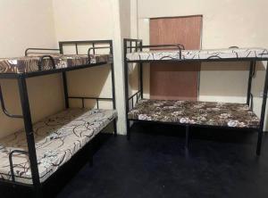 two bunk beds sitting in a room with at Negombo hostel in Negombo