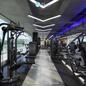 a gym with treadmills and machines in a building at Happy House Ecopark Westbay A in Cong Luận
