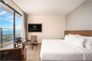 Postel nebo postele na pokoji v ubytování Hotel Apec Tuy Hoa