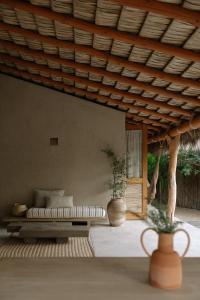 a living room with a couch and a table at Proyecto Palmita in El Pescadero