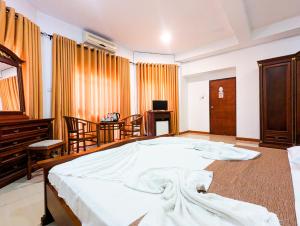 Postel nebo postele na pokoji v ubytování D Mount View Hotel Kandy