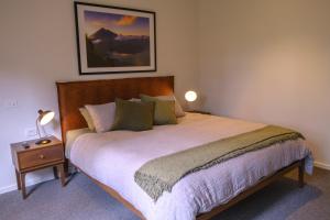 A bed or beds in a room at Waldhütte your enchanting forest retreat!