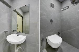 um banheiro com uma pia, um vaso sanitário e um espelho em Super Hotel O Pune Kasarwadi Railway Station em Pune