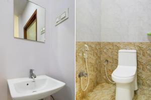 a bathroom with a sink and a toilet and a mirror at Super Collection O L.B Nagar Metro Station Formerly D N Groups in Surūrnagar