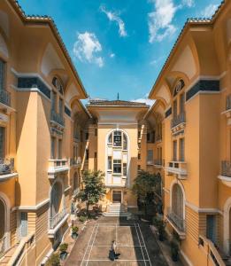 an empty courtyard of a building at Soi by La Doma Express in Ho Chi Minh City
