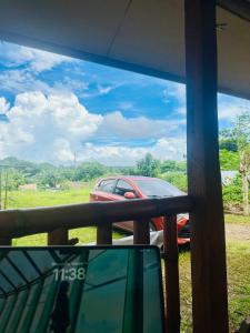 a view of a car parked on a porch at TeamV Kubo Guesthouse in Agdañgan