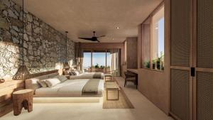 Giường trong phòng chung tại Luxury Villas By Awa Holbox - Beachfront