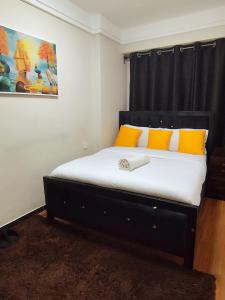 Ένα ή περισσότερα κρεβάτια σε δωμάτιο στο Sanctum comfy Homes at Kindaruma