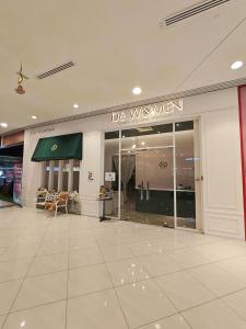 a store front with a sign that reads do westman at HI Studio Mesahill Premier - KLIA - Bathtub - WIFI & NETFLIX in Nilai +119 photos