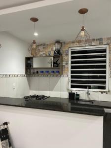 Una cocina o cocineta en Residencial Reis