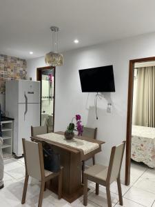 Una televisión o centro de entretenimiento en Residencial Reis