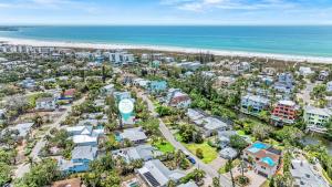 an aerial view of a resort with the beach at Beach Walk Cottage - 451 in Siesta Key
