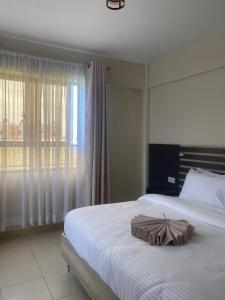 Postel nebo postele na pokoji v ubytování The Abode Naivasha