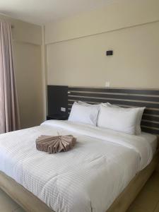 Postel nebo postele na pokoji v ubytování The Abode Naivasha