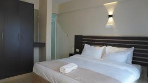 Postel nebo postele na pokoji v ubytování The Abode Naivasha