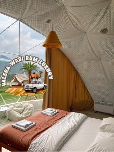 a bedroom with a bed and a truck in a tent at Valera wadi rum Luxury in Wadi Rum
