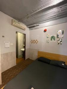 a bedroom with a bed and a bathroom with a sink at Ubuntu Central Stay 57 Hang Be in Hanoi