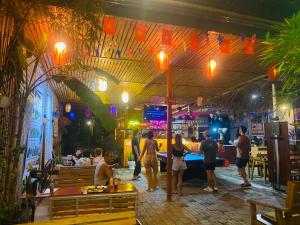 a group of people standing in a restaurant at Big J gest house in Ninh Binh