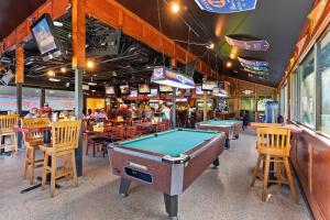 a restaurant with a pool table in the middle at A145 HH Beach & Tennis Resort in Hilton Head Island