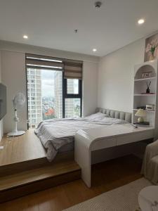 Postel nebo postele na pokoji v ubytování Góc Nắng HomeStay and Apartment