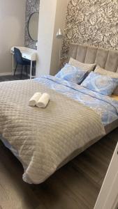 Ένα ή περισσότερα κρεβάτια σε δωμάτιο στο Air-Hotel Moldova