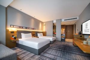 Postel nebo postele na pokoji v ubytování Eastern Wenlan Hotel + 20 fotografií