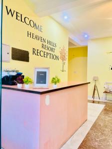 a welcome sign on the wall of a hospital lobby at Heaven hill Pushkar in Pushkar