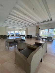 a large room with couches and a pool table at 2-bedroom unit with Sea & Mountain View in Dumaguete