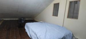 Ένα ή περισσότερα κρεβάτια σε δωμάτιο στο Naga Cozy home +1 φωτογραφίες