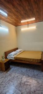 Postel nebo postele na pokoji v ubytování Tharavadu veed homestay Thekkady