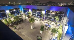 an overhead view of a patio with tables and chairs at CS Premier Hotel in Seoul