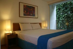 Ένα ή περισσότερα κρεβάτια σε δωμάτιο στο Concordia Hotel Bumi Sangkuriang Bandung