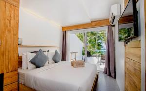 Postel nebo postele na pokoji v ubytování Zuzuni Boutique Hotel