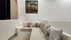 a row of pillows lined up against a wall at Bnaya Villas Riverside in Amed