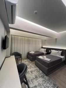 Ένα ή περισσότερα κρεβάτια σε δωμάτιο στο Grand Museum Pyramids