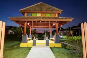 a gazebo in front of a house at Khaoyai Nature Life & Tour Resort in Nong Nam Daeng