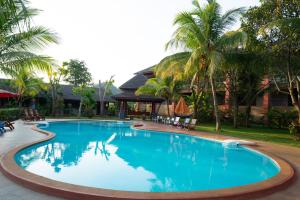 a large swimming pool in front of a resort at Khaoyai Nature Life & Tour Resort in Nong Nam Daeng