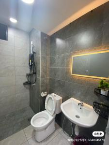 a bathroom with a toilet and a sink at Traders park Balakong 3 room Wi-Fi balcony unblock view in Cheras