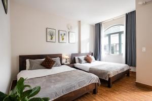 Postel nebo postele na pokoji v ubytování An Vy DaLat Central - Gần chợ đêm Đà Lạt