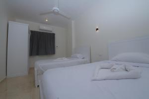 Postel nebo postele na pokoji v ubytování King Nile Luxor