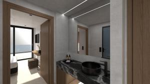 Un baño con lavabo y una gran ventana. en Anesea City, en Heraklion