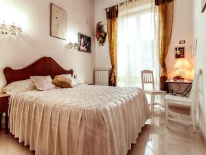 Postel nebo postele na pokoji v ubytování Il Veliero B&B
