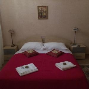 a bed with towels and napkins on top of it at Apartment Aida in Rijeka